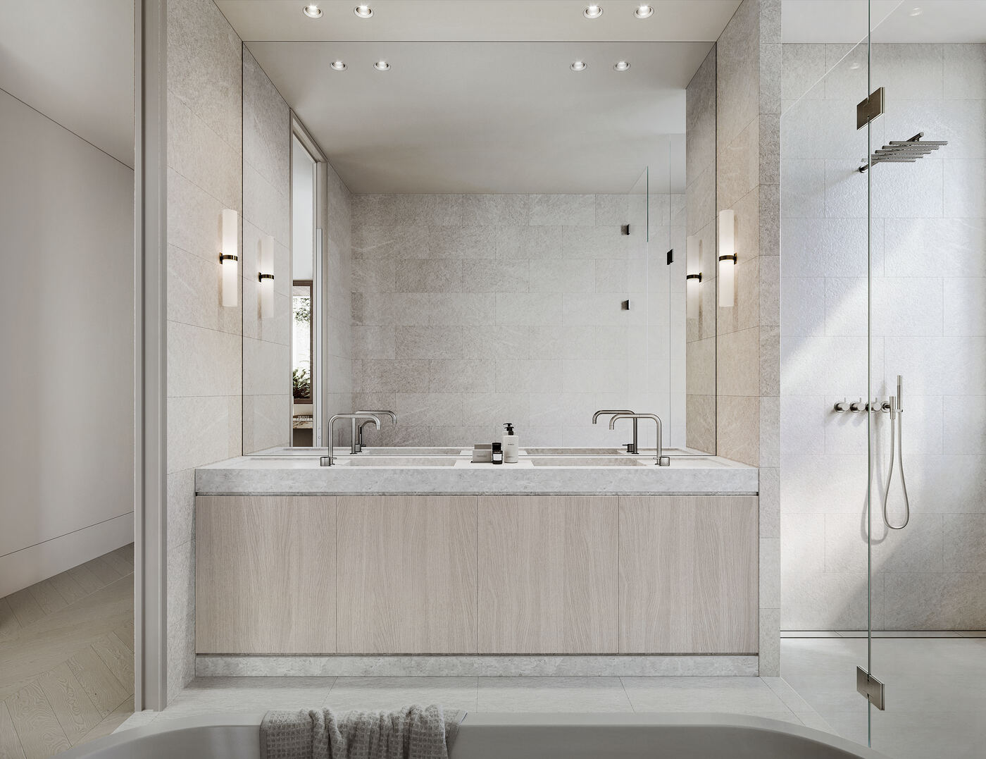 Ensuite bathroom with a double stone vanity, backlit mirror, freestanding bath, and frameless glass shower.